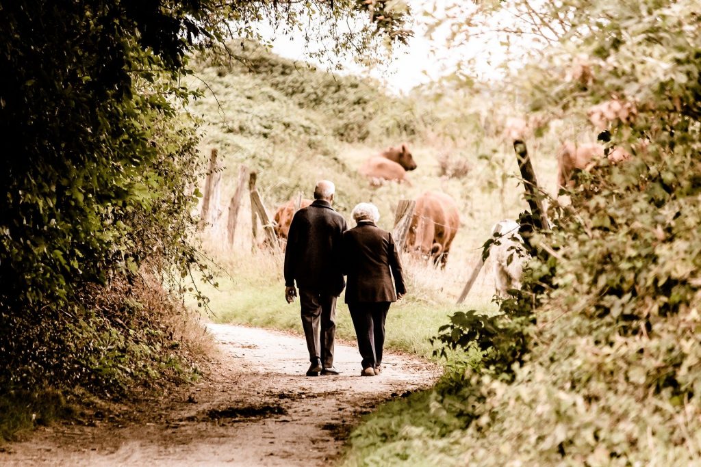 couple holding hands walking